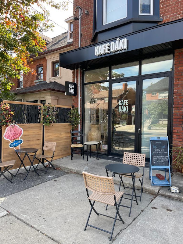 Kafe Dáki's black storefront and white sign at 226 Oakwood Avenue